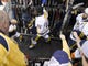 Fan Robert Poteete shakes hands with Predators defenseman