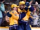 Nashville Predators right wing Craig Smith, left, celebrates