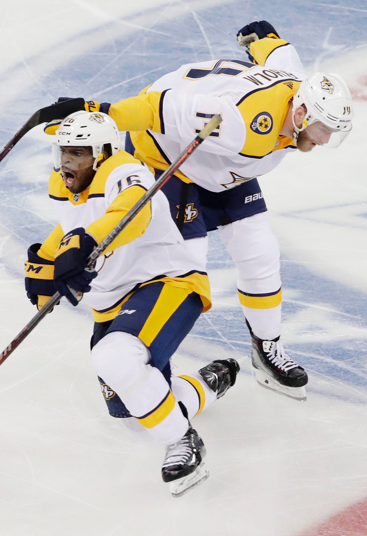 Nashville Predators' P.K. Subban (76) celebrates with Mattias Ekholm (14) after scoring a goal during the third period of an NHL hockey game against the New York Rangers on Thursday, Oct. 4, 2018, in New York. The Predators won 3-2.