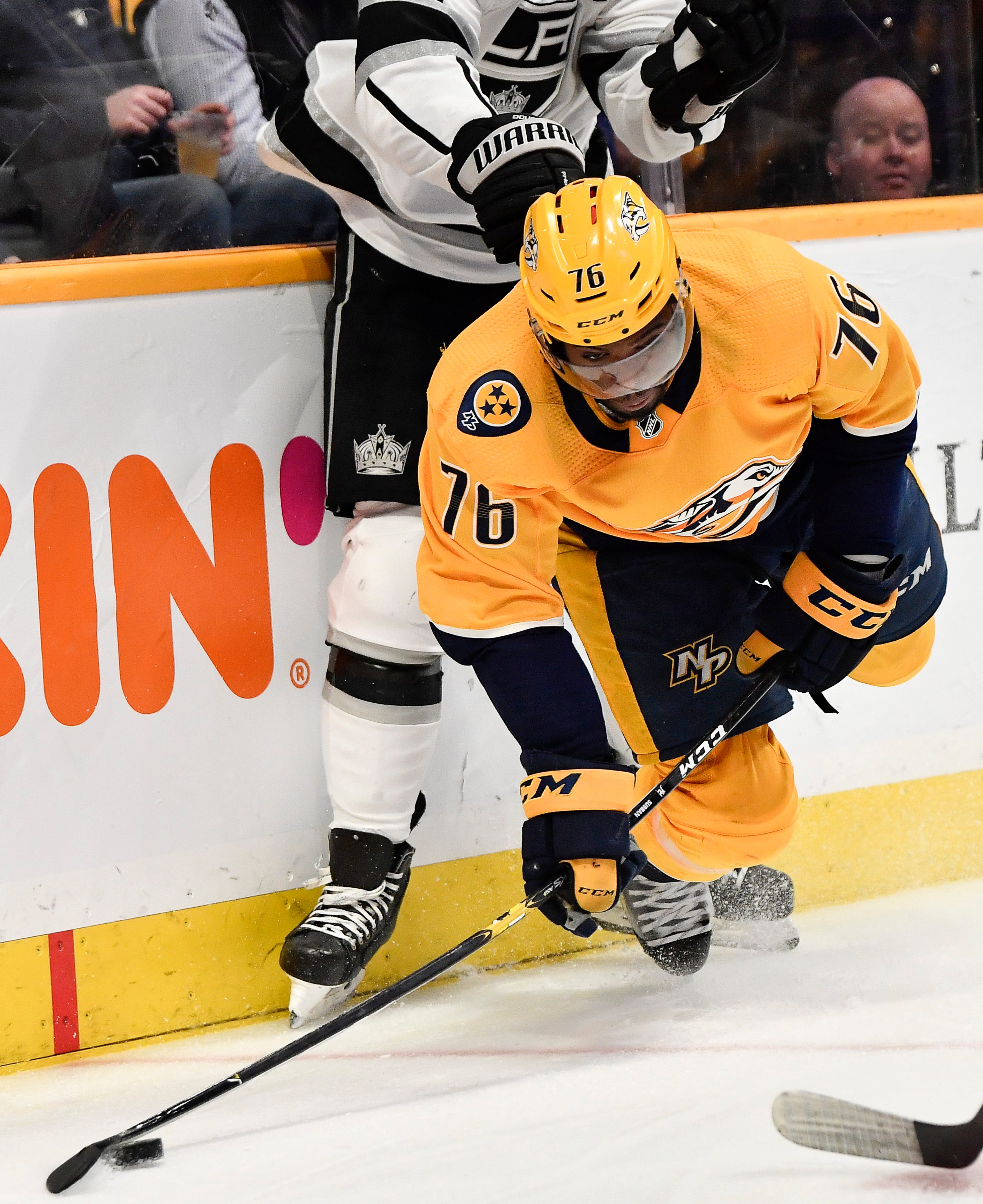 Predators defenseman P.K. Subban (76) passes the puck past Kings defenseman Drew Doughty (8) last he falls to the ice during the third period at Bridgestone Arena Thursday, Feb. 21, 2019 in Nashville, Tenn. 