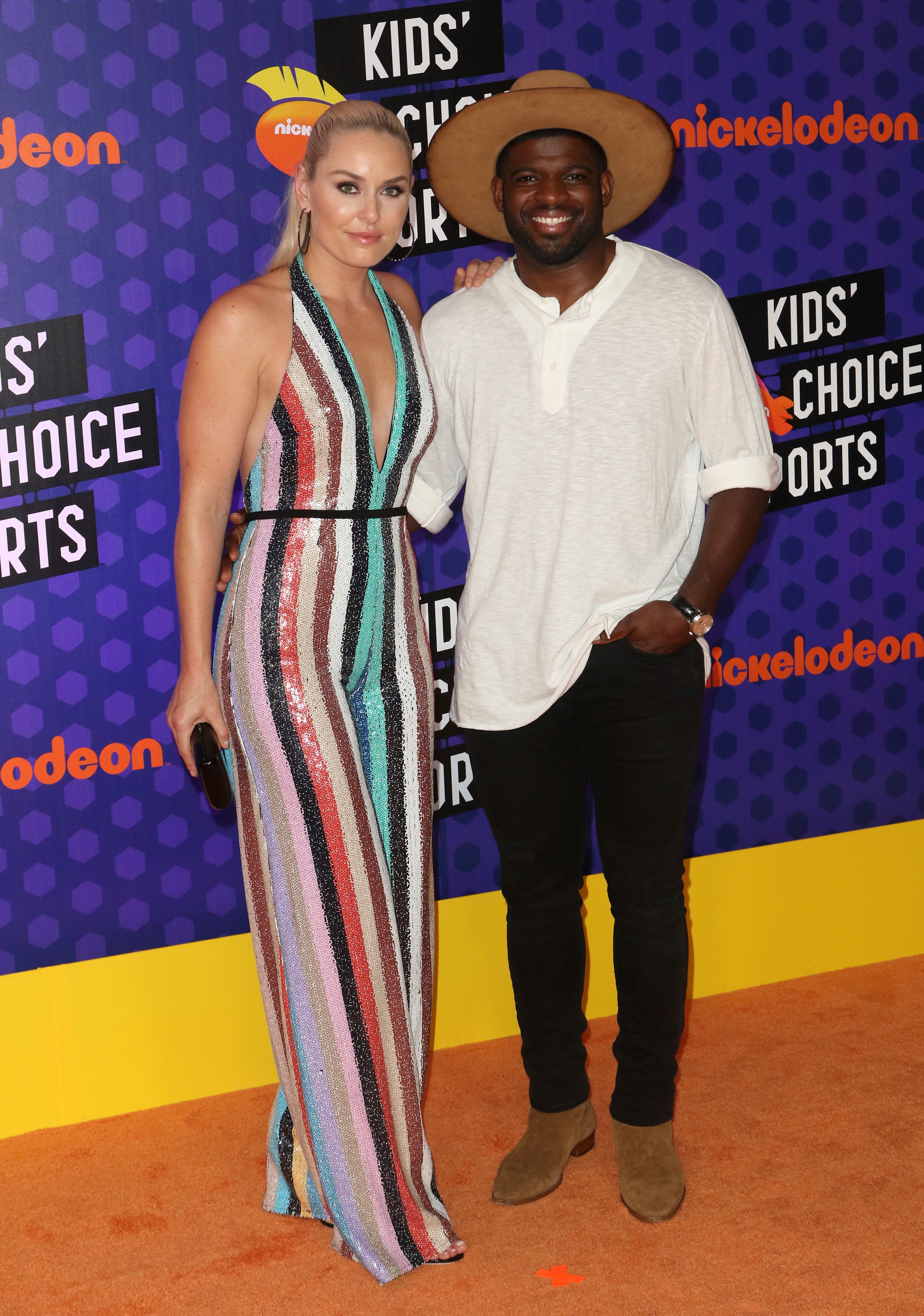 NHL hockey player P. K. Subban, of the Nashville Predators, right, and skier Lindsey Vonn arrive at the Kids' Choice Sports Awards at the Barker Hangar on Thursday, July 19, 2018, in Santa Monica, Calif.