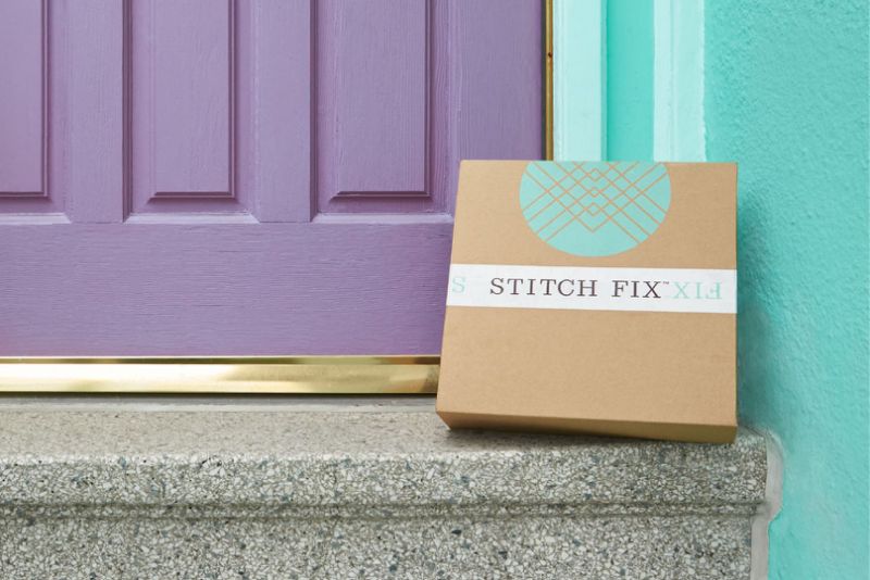 Stitch Fix box on a step in front of a door.