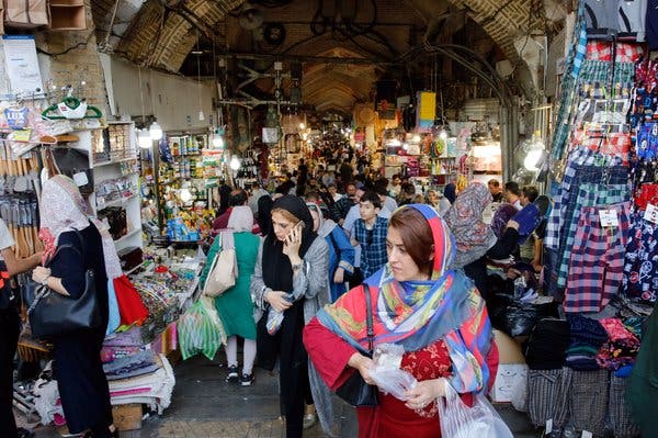 Iranians at the old grand bazaar on Monday. The inflation rate in Iran has risen to about 50 percent.