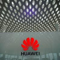 A Huawei company logo is displayed at the Shenzhen International Airport in Shenzhen, Guangdong province, China, June 17.