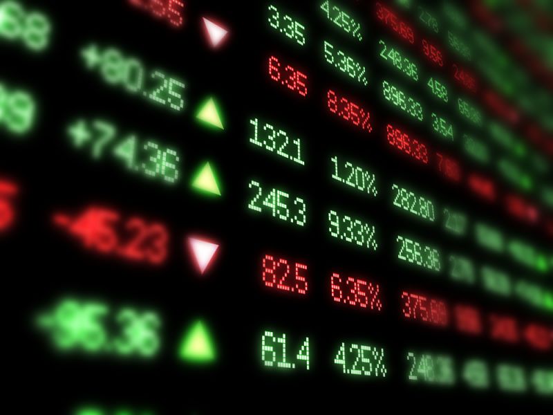 Red and green columns of numbers showing stock price movements on a black background