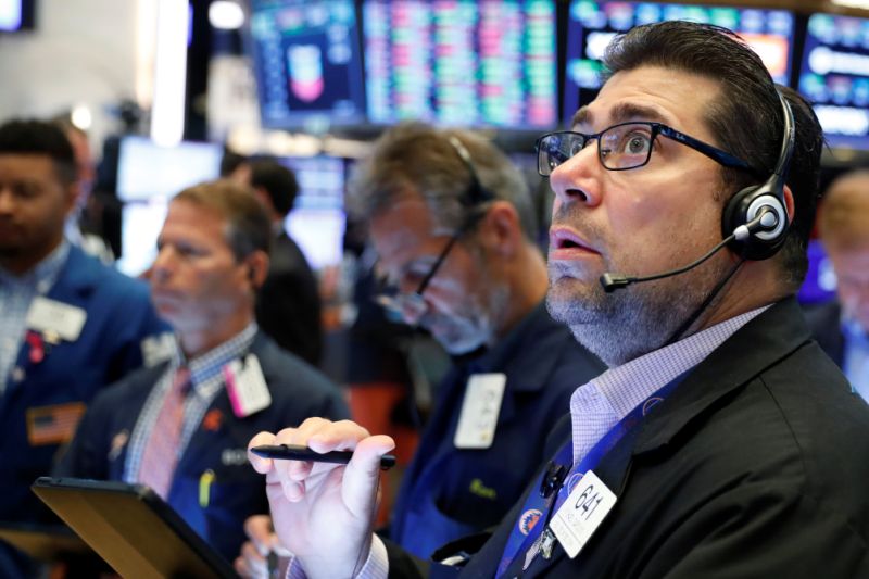 Traders work on the floor of the New York Stock Exchange shortly after the opening bell in New York, U.S., July 12, 2019. REUTERS/Lucas Jackson