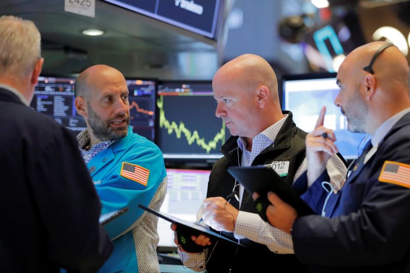 Traders work on the floor of the New York Stock Exchange shortly after the opening bell in New York, U.S., July 12, 2019. REUTERS/Lucas Jackson