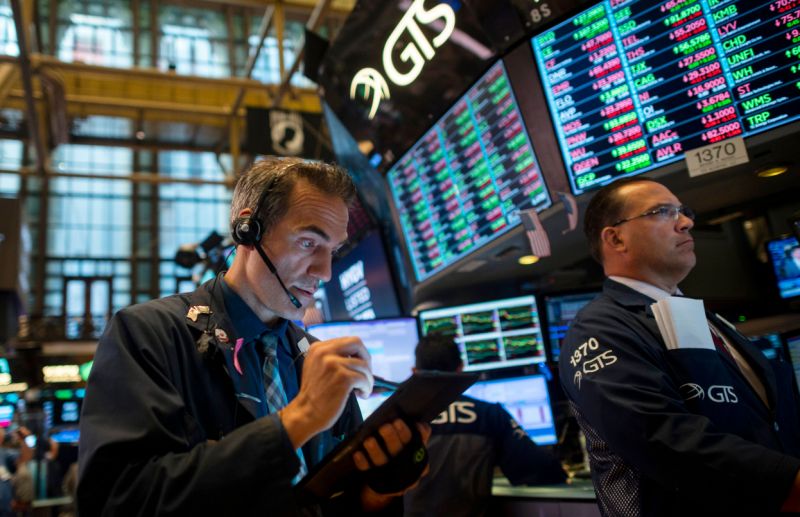 Traders work after the opening bell at the New York Stock Exchange (NYSE) on July 16, 2019, in New York City. - Wall Street stocks edged down from records early Tuesday following mixed banking earnings and worrisome manufacturing data contrasted with strong US retail sales. Shares of JPMorgan Chase, the largest US bank by assets, were slightly negative despite reporting record quarterly earnings as investors focused on the bank's lowered forecast for net interest income in anticipation of Federal Reserve moves to cut interest rates. (Photo by Johannes EISELE / AFP) (Photo credit should read JOHANNES EISELE/AFP/Getty Images)