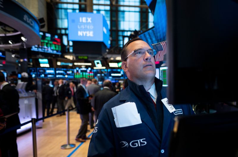 A trader works ahead the opening bell at the New York Stock Exchange (NYSE) on June 18, 2019 located at Wall Street in New York City. (Photo by Johannes EISELE / AFP) (Photo credit should read JOHANNES EISELE/AFP/Getty Images)