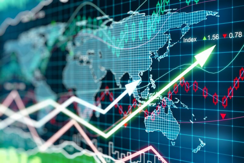 Digital world map with charts indicating gains.