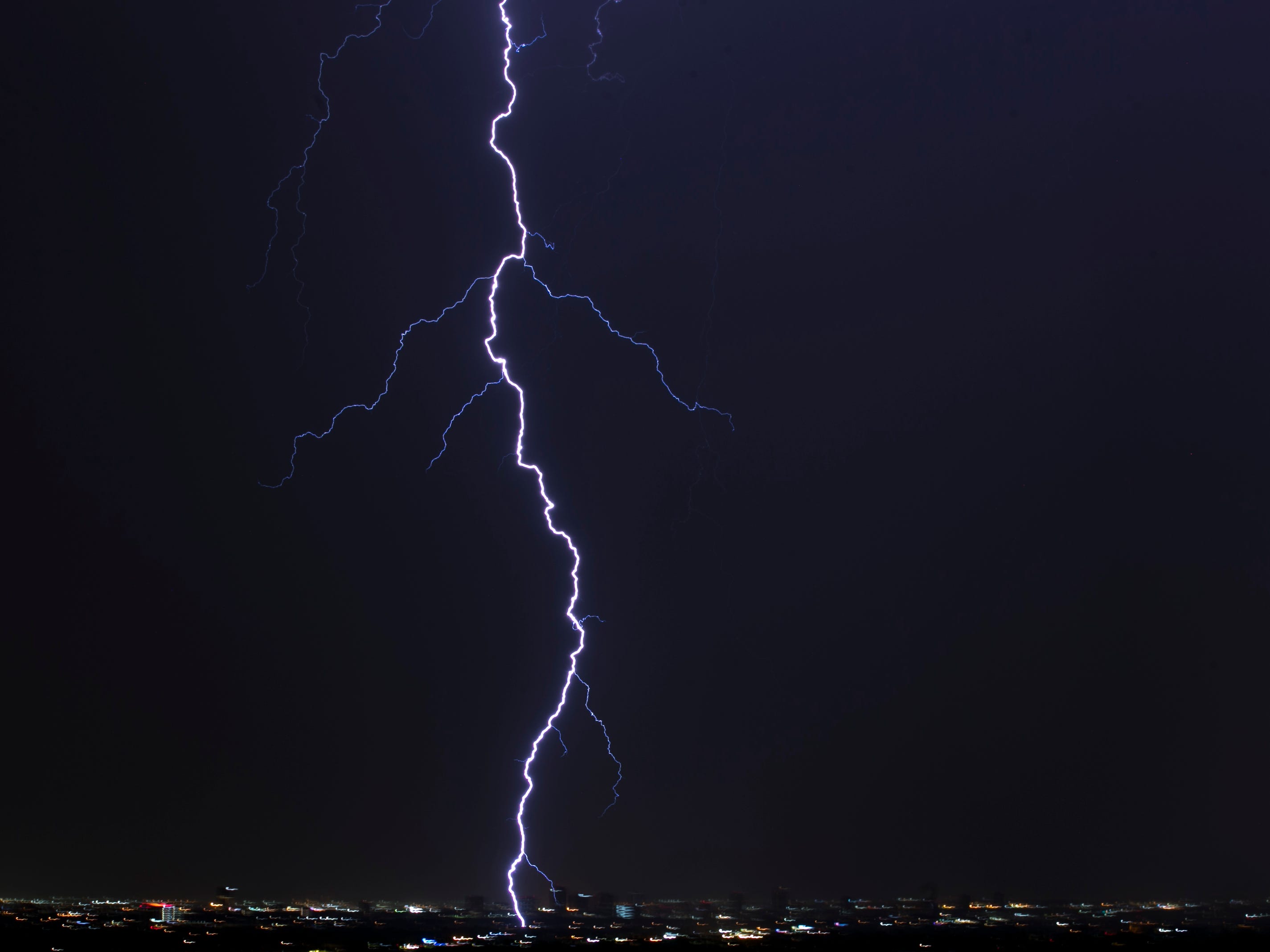 Lightning strikes over downtown Phoenix.