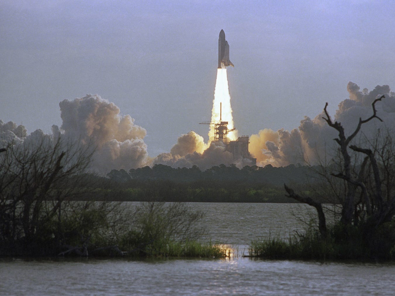 The Space Shuttle orbiter Discovery lifts off from Launch Pad 398 in Kennedy Space Center at morning on April 24, 1990, carrying a crew of five and the Hubble Space Telescope. The mission, STS-31, had been originally scheduled for launch on April 10th but was scrubbed because of a faulty APU. NASA officials and scientist around the world are looking forward to the first glimpse into space by the telescope.