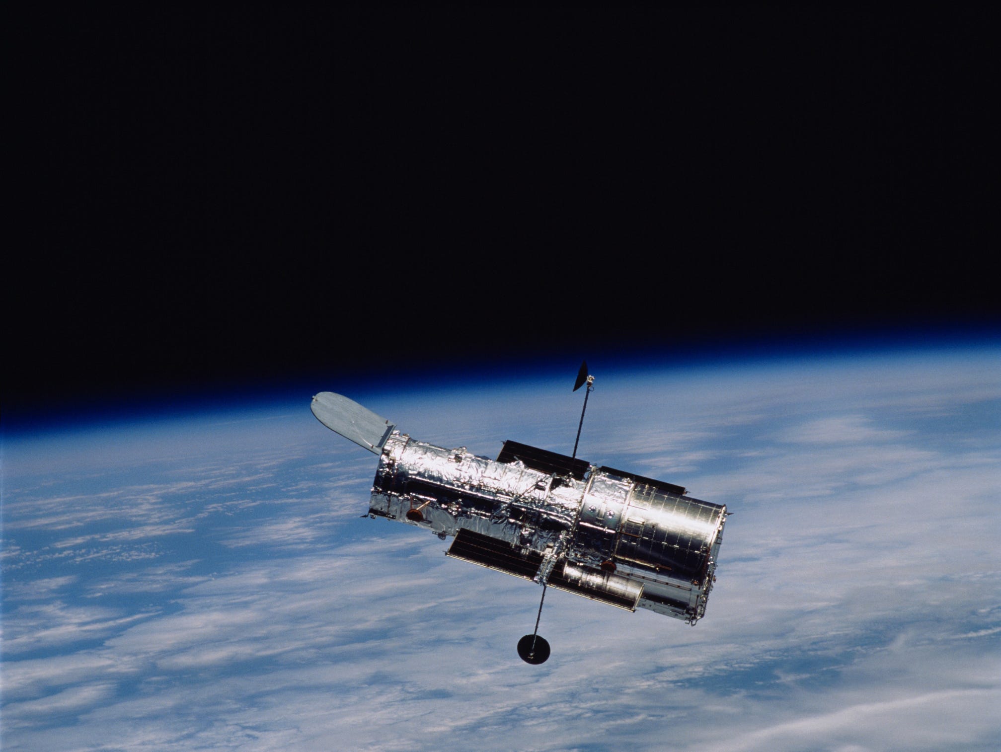 The fourth Hubble Telescope servicing mission, returned to Earth, in 2002, after the crew performed five spacewalks to install solar arrays, a camera, a power control unit, a reaction wheel assembly and an experimental cooling system. NASA’s Marshall Space Flight Center designed, developed and built the telescope, which launched and was deployed in April 1990.