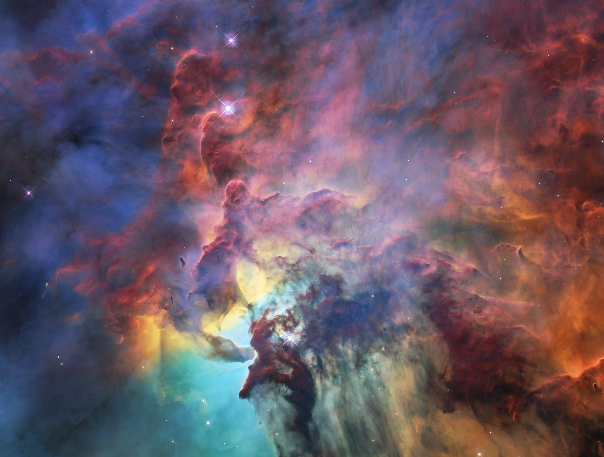 A colourful image of the Lagoon Nebula seen by the NASA/ESA Hubble Space Telescope.