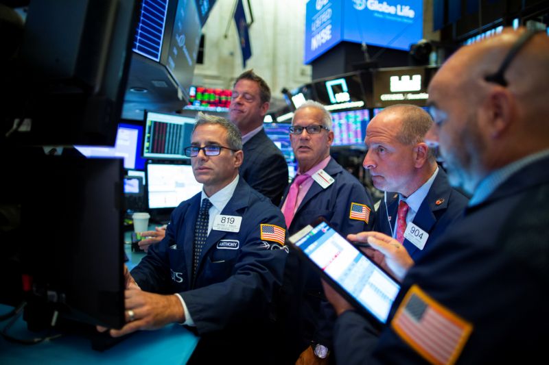 Traders work on the floor at the New York Stock Exchange (NYSE) in New York, U.S., August 12, 2019. REUTERS/Eduardo Munoz