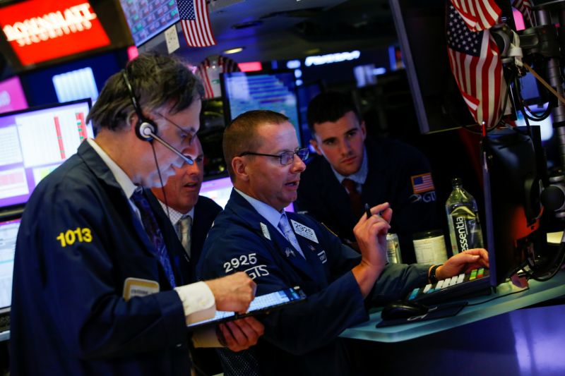 Traders work on the floor at the New York Stock Exchange (NYSE) in New York, U.S., August 14, 2019. REUTERS/Eduardo Munoz