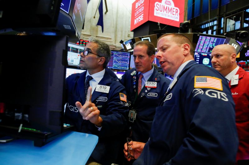 Traders work on the floor at the New York Stock Exchange (NYSE) in New York, U.S., August 14, 2019. REUTERS/Eduardo Munoz