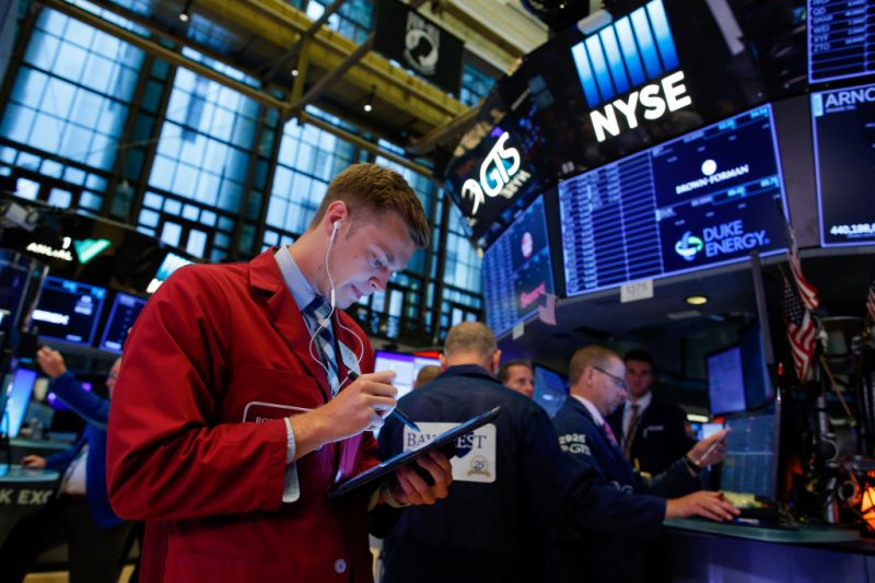 Traders work on the floor at the New York Stock Exchange (NYSE) in New York, U.S., August 13, 2019. REUTERS/Eduardo Munoz