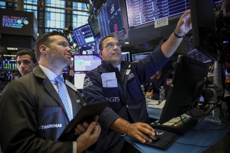 NEW YORK, NY - AUGUST 19: Traders and financial professionals work on the floor of the New York Stock Exchange (NYSE) at the opening bell on August 19, 2019 in New York City. The Dow Jones Industrial Average traded over 300 points higher at the open on Monday morning. (Photo by Drew Angerer/Getty Images)