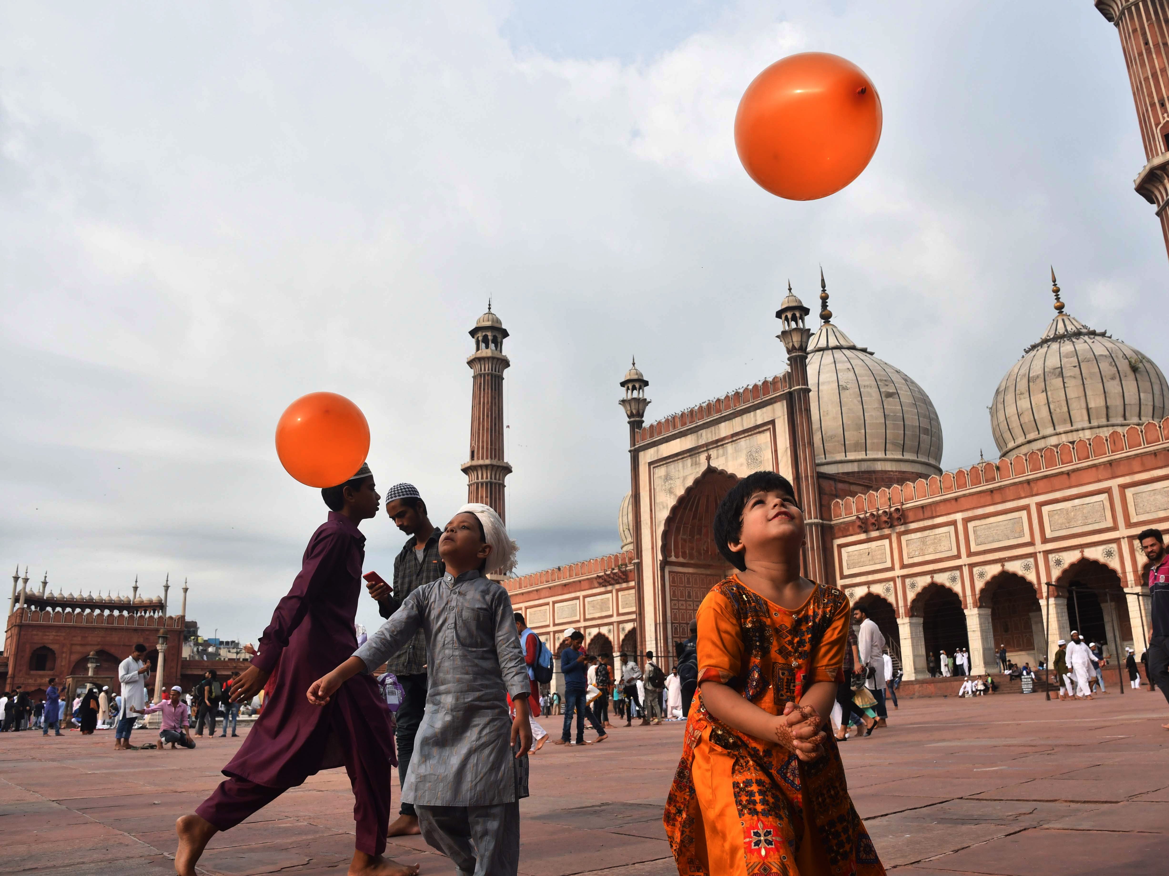 Children play after Eid al-Adha prayers at the Jama Masjid mosque in New Delhi, India.