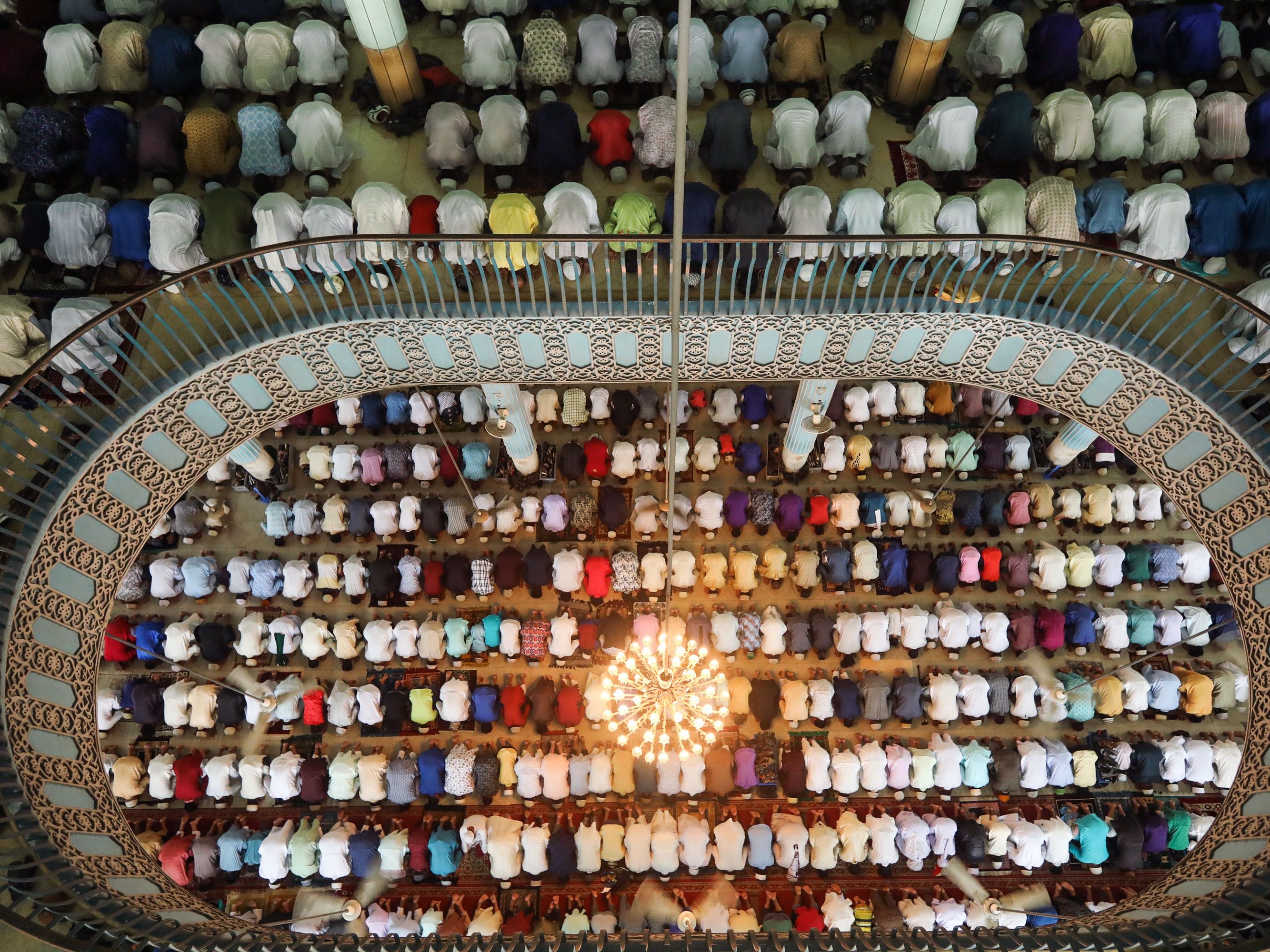 Muslims attend Eid al-Adha prayers at Baitul Mukarram National Mosque in Dhaka, Bangladesh. 