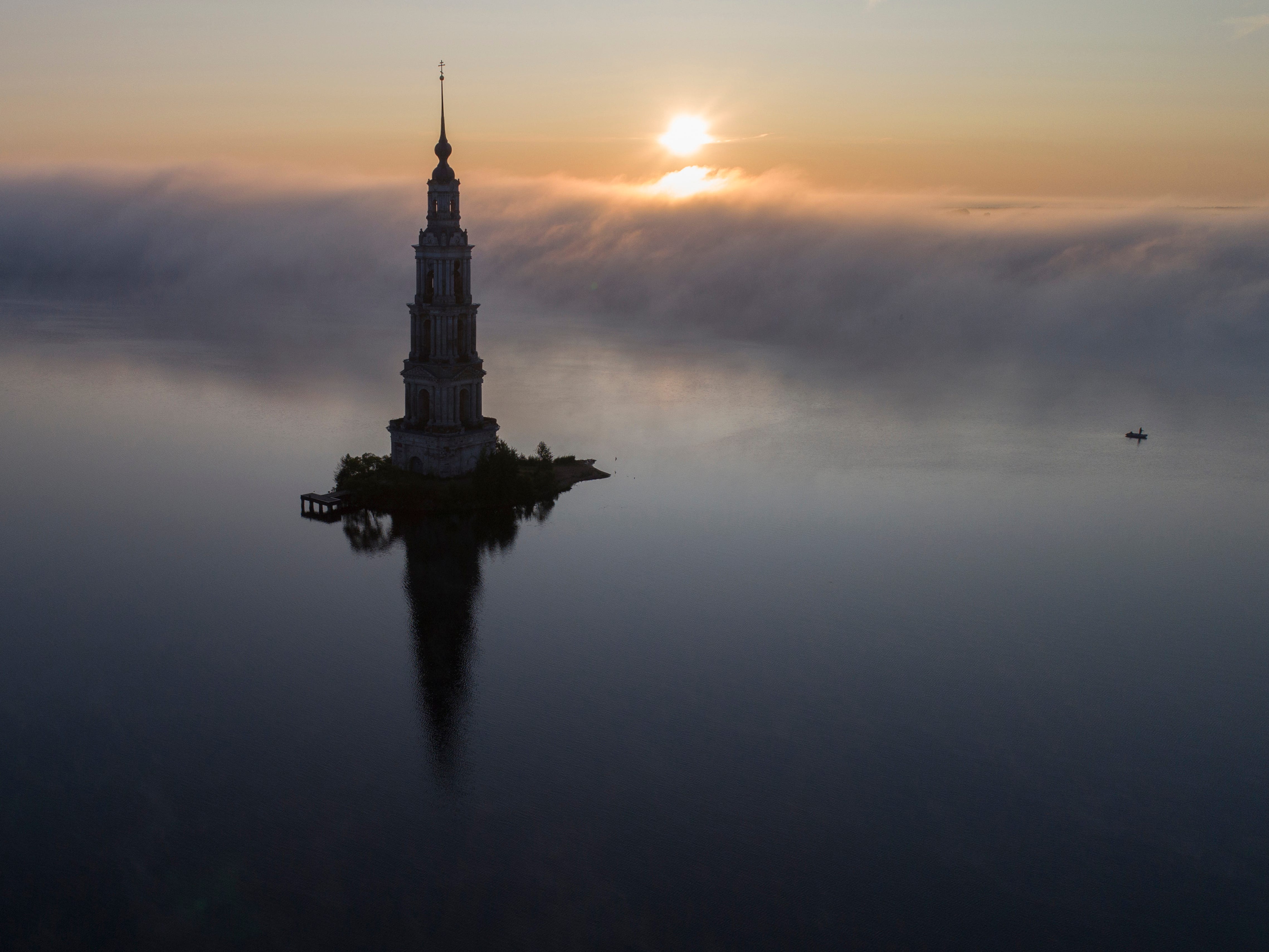 The famous Kalyazin Bell Tower, part of the submerged monastery of St. Nicholas, is seen in the morning fog in Kalyazin, Russia.