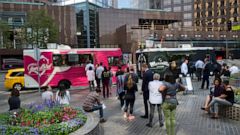 FILE- In this Sept. 20, 2018, file photo Los Angeles office workers line up for lunch at food trucks parked in downtown Los Angeles. The majority of small business owners who work solo struggle to make their companies profitable. That’s one of the fi