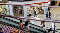 In this Aug. 7, 2019, photo shoppers ride an escalator inside the Glendale Galleria in Glendale, Calif. If a threat of a recession gives you pause when it comes to your personal finances, remember now is a time to prepare, not panic. Financial expert