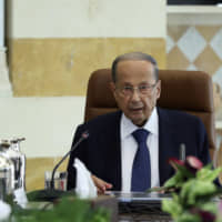 In this photo released by Lebanon's official government photographer, Dalati Nohra, Lebanese President Michel Aoun meets with political leaders with the aim of finding solutions to the country's economic crisis, in the presidential palace, in Baabda, east of Beirut Monday. Aoun said in a speech at the opening of the one-day session that everyone should make "sacrifices" in order to get one of the world's most indebted countries out of its problems.