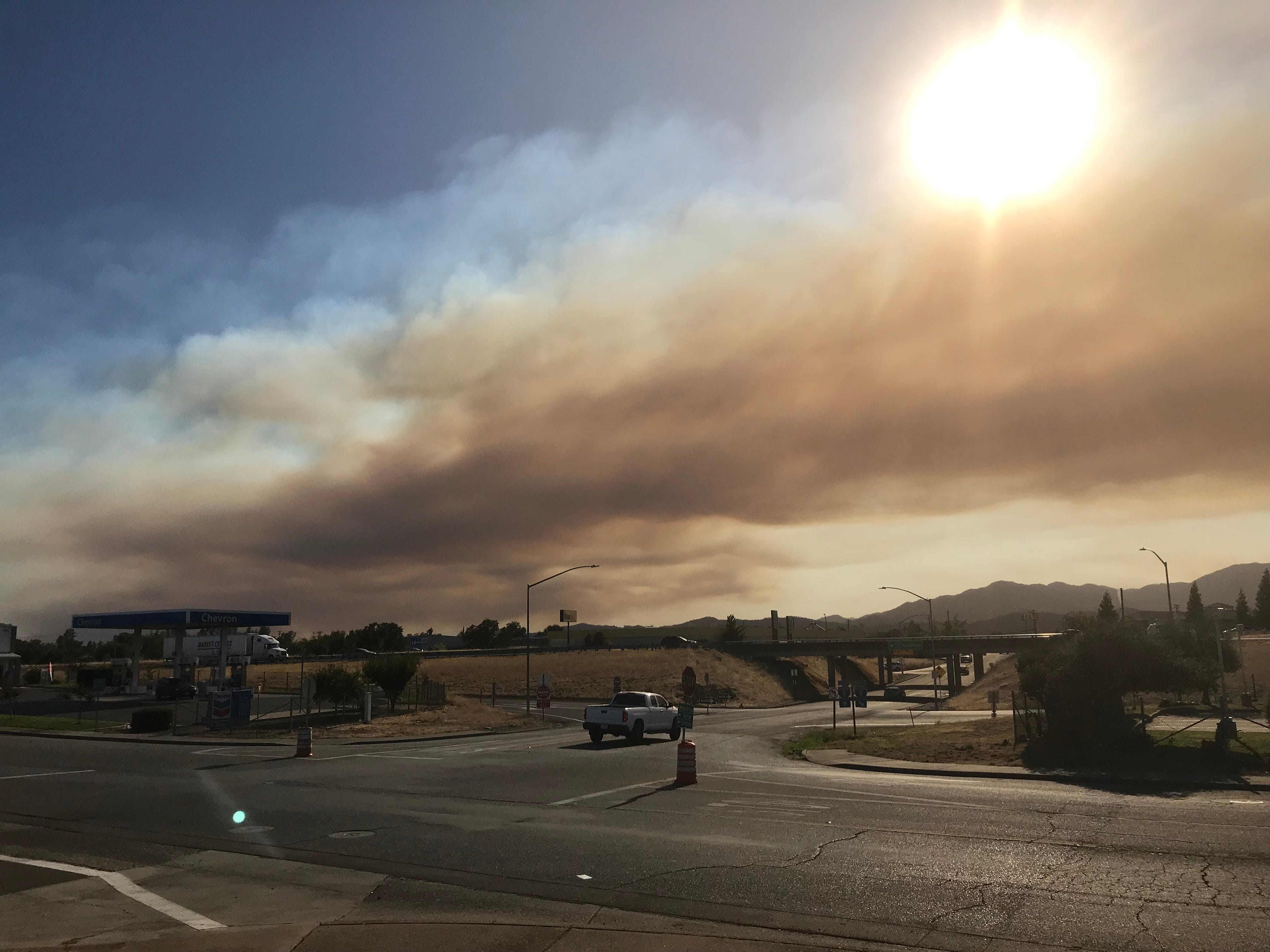 Smoke from the Red Bank Fire outside of Red Bluff stretches into north Redding.