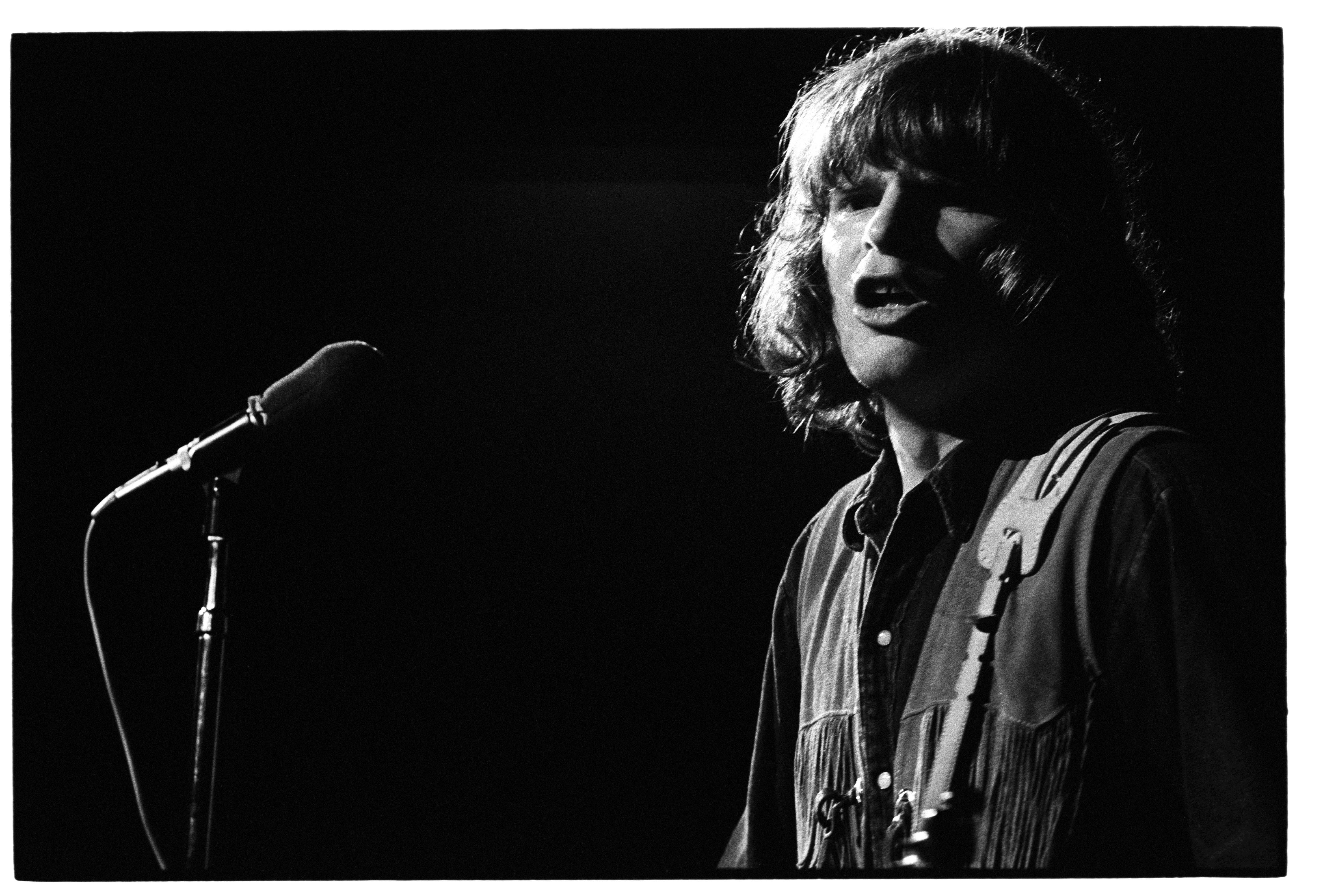 John Fogerty of Creedence Clearwater Revival plays at Woodstock in 1969.