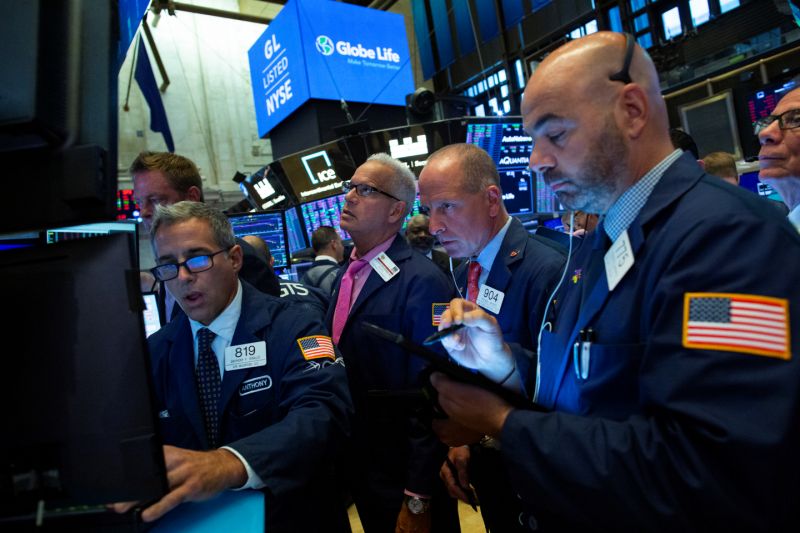 Traders work on the floor at the New York Stock Exchange (NYSE) in New York, U.S., August 12, 2019. REUTERS/Eduardo Munoz