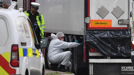 British Police forensics officers work on ther lorry found to be containing 39 dead bodies, at Waterglade Industrial Park in Grays, east of London, on October 23, 2019.