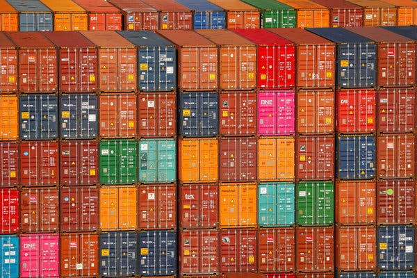 Cargo containers on a ship docked at the Port of Los Angeles earlier this year. Trade upheaval with China has been a wild card in economic output.