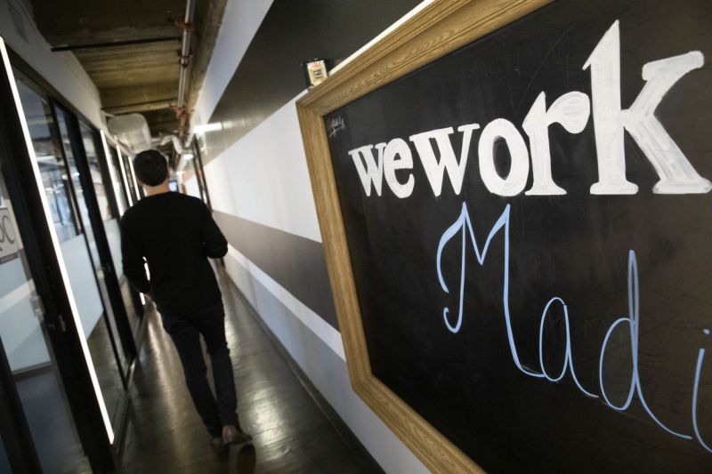 This Tuesday, Nov. 5, 2019, photo shows a WeWork office space in New York. WeWork said Friday, Nov. 8 it will divest from several side businesses and cut jobs as part of a 90-day plan to turn itself around following its botched attempt to sell stock on Wall Street. (AP Photo/Mark Lennihan)