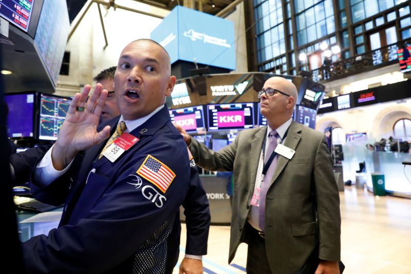 Traders work on the floor at the New York Stock Exchange (NYSE) in New York. REUTERS/Brendan McDermid