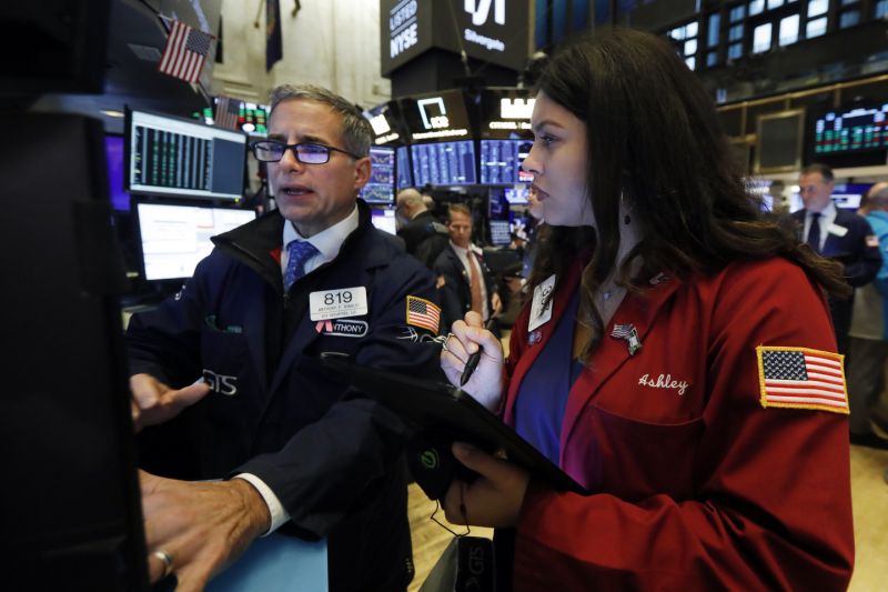 Specialist Anthony Rinaldi, left, and trader Ashley Lara work on the floor of the New York Stock Exchange, Thursday, Nov. 7, 2019. (AP Photo/Richard Drew)