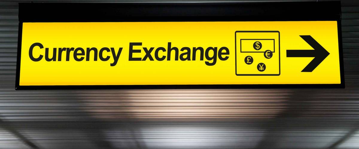 sign currency exchange at the airport with money currency icon and arrow for direction to currency exchange booth counter service for tourist