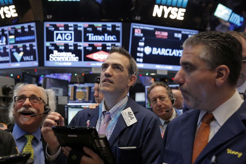 Traders work on the floor of the New York Stock Exchange (NYSE) shortly after the opening bell in New York, NY, U.S. December 14, 2016. REUTERS/Lucas Jackson