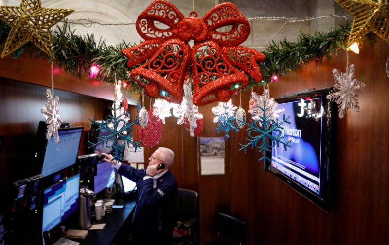 A trader works at his stall on the floor at the New York Stock Exchange (NYSE) in New York, U.S., December 17, 2019. REUTERS/Brendan McDermid