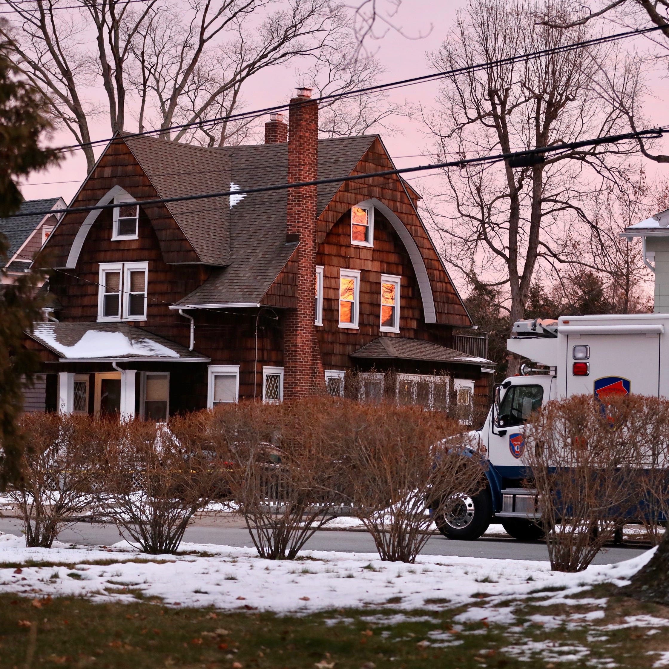 A Westchester County Police truck sits near 57 Romer Ave. in Pleasantville on Friday, Dec. 6, 2019 after four people were found dead at the house.