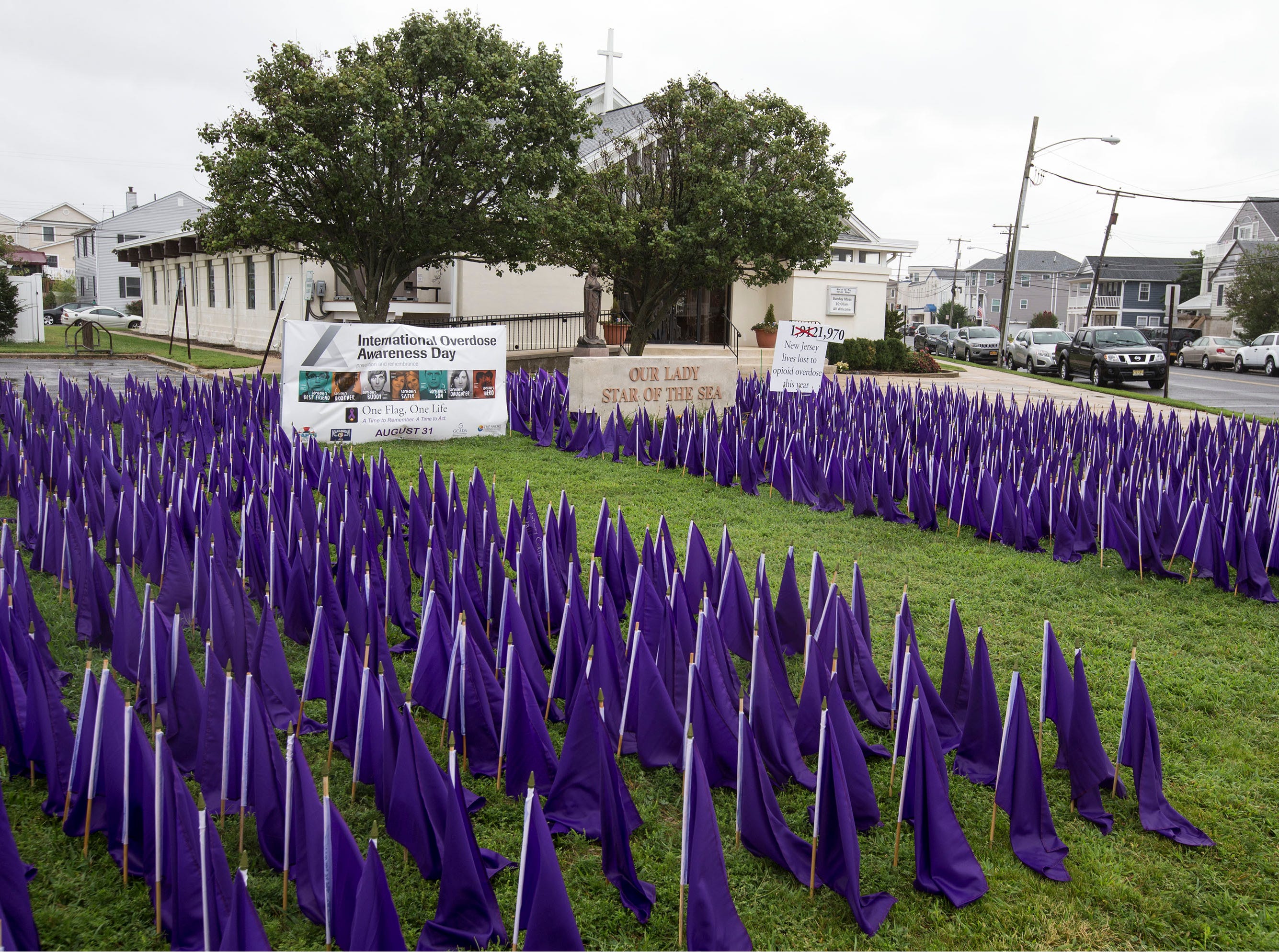 A sea of purple flags along the front lawn of Our Lady Star of the Sea represents the lives lost to opioid overdose in the state of New Jersey. As of today, International Overdose Awareness Day, which occurs every August 31, New Jersey has lost 1,970 lives. Manasquan, NJ Friday, August 31, 2018 