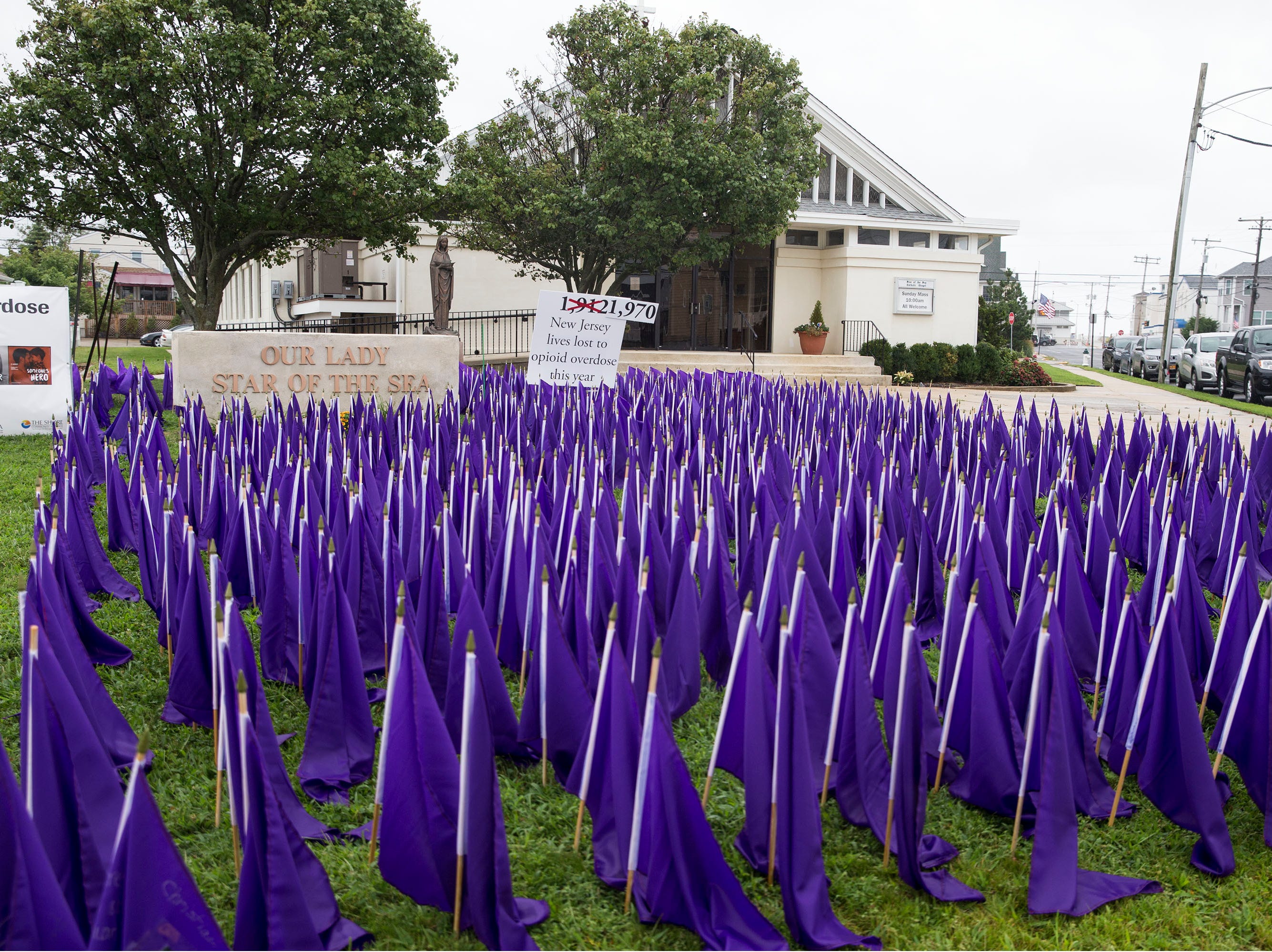 A sea of purple flags along the front lawn of Our Lady Star of the Sea represents the lives lost to opioid overdose in the state of New Jersey. As of today, International Overdose Awareness Day, which occurs every August 31, New Jersey has lost 1,970 lives. Manasquan, NJ Friday, August 31, 2018 