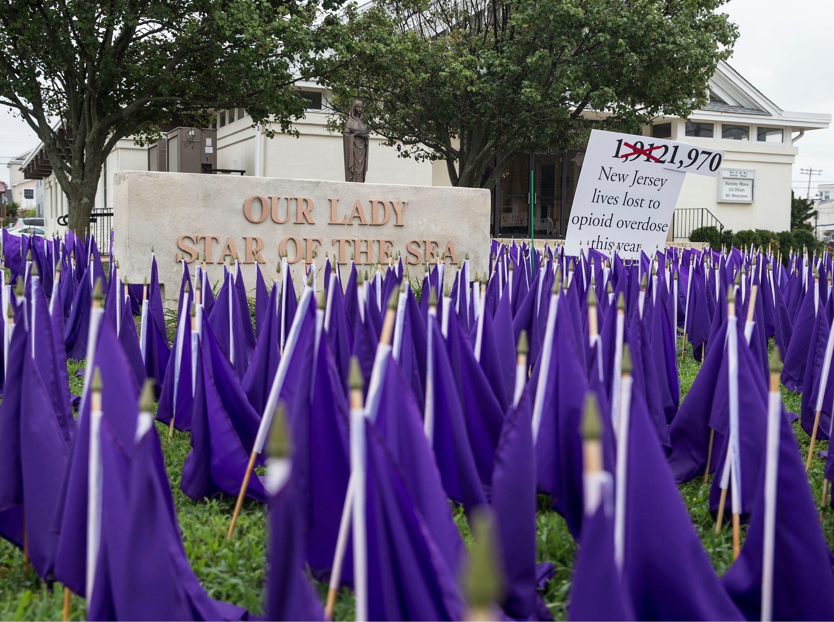 A sea of purple flags along the front lawn of Our Lady Star of the Sea represents the lives lost to opioid overdose in the state of New Jersey. As of today, International Overdose Awareness Day, which occurs every August 31, New Jersey has lost 1,970 lives. Manasquan, NJ Friday, August 31, 2018 