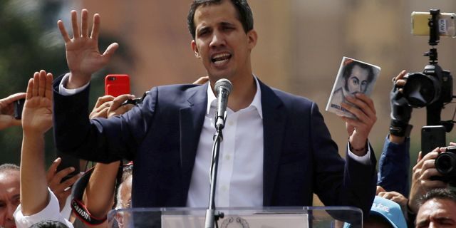 Juan Guaido, head of Venezuela's opposition-run congress, declares himself interim president of Venezuela, during a rally demanding President Nicolas Maduro's resignation in Caracas, Venezuela, Wednesday, Jan. 23, 2019. (AP Photo/Fernando Llano)