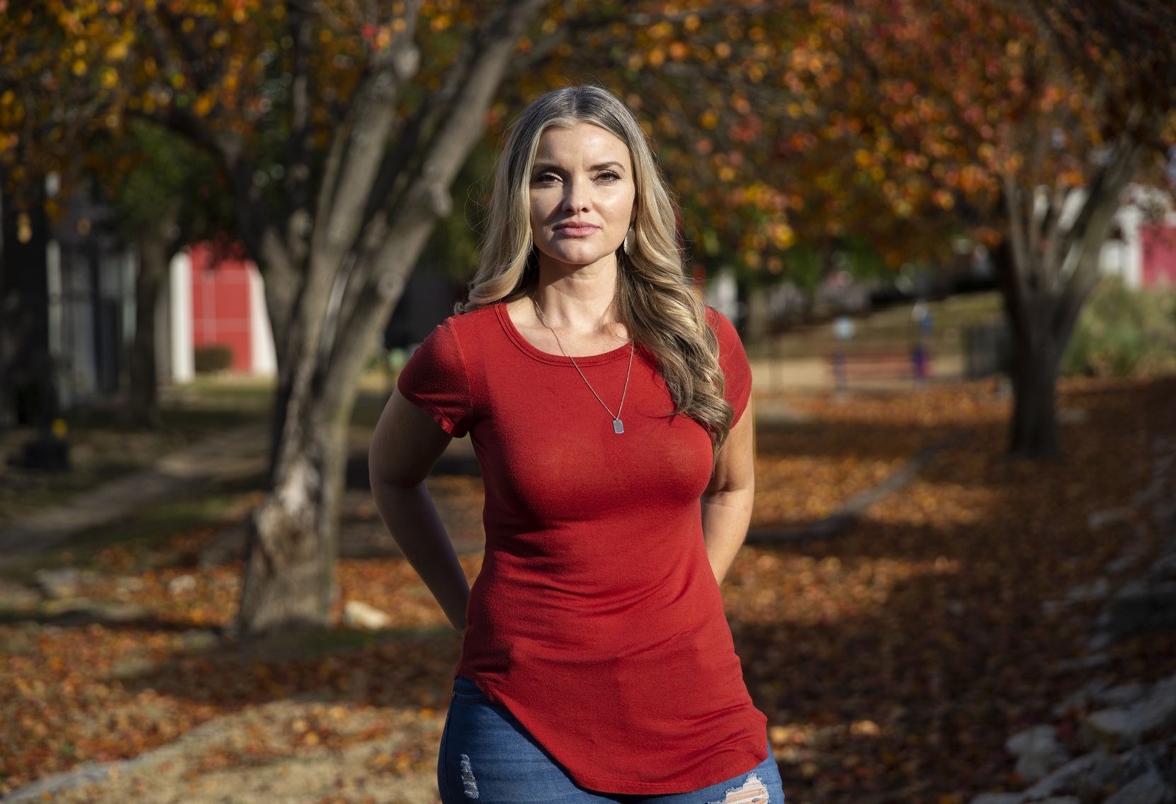 Jamie Nickerson poses outside of her home on Nov. 25, 2019 in Fort Worth. A July 2018 botched robbery at Veritex Community Bank on Merrick Street left her and two other employees injured. Nickerson still suffers from mental and physical trauma from the shooting. (Juan Figueroa/ The Dallas Morning News)