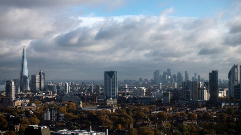 The Shard and financial district of Canary Wharf in London, England.