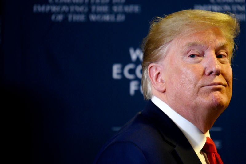 US President Donald Trump looks back as a question from the press is shouted after a press conference at the World Economic Forum in Davos, Switzerland, on January 22, 2020. (Photo by JIM WATSON / AFP) (Photo by JIM WATSON/AFP via Getty Images)