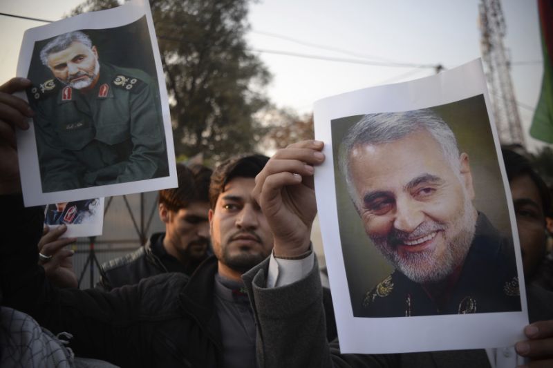 Pakistani demonstrate over the U.S. airstrike in Iraq that killed Iranian Revolutionary Guard Gen. Qassem Soleimani, in Peshawar, Pakistan, Friday, Jan. 3, 2020. Iran has vowed "harsh retaliation" for the U.S. airstrike near Baghdad's airport that killed Tehran's top general and the architect of its interventions across the Middle East, as tensions soared in the wake of the targeted killing. (AP Photo/Muhammad Sajjad)