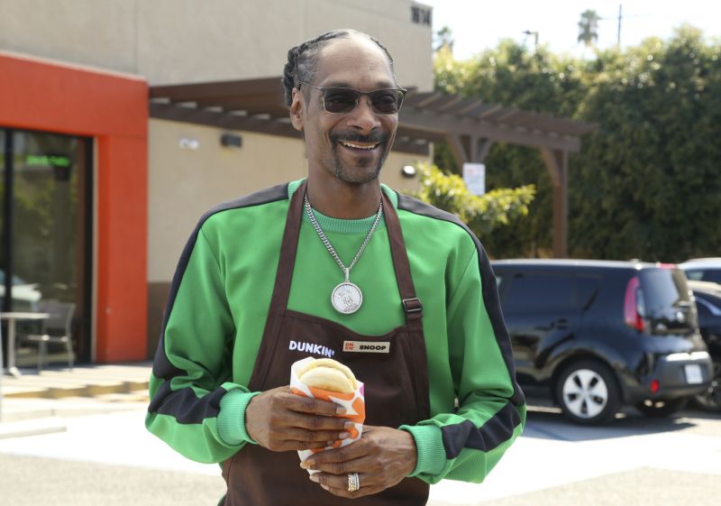 IMAGE DISTRIBUTED FOR BEYOND MEAT - In this image taken on Oct. 23, 2019, Snoop Dogg surprised fans in celebration of the national launch of Dunkin’s new Beyond Sausage Sandwich in partnership with Beyond Meat at Dunkin’ in Los Angeles. (Photo by Casey Rodgers/Invision for Beyond Meat/AP Images)